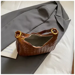 Deep brown crescent woven hobo bag with gold ring detail for stylish commuting fashion