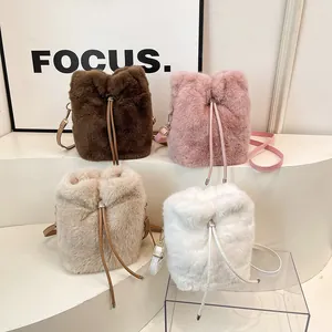 Chic faux fur bucket bags with drawstring closure and leather straps in four colors