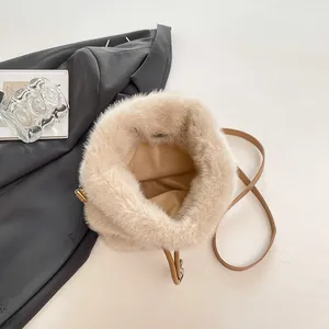 Chic beige faux fur bucket bag with chain strap for 2025 autumn fashion style