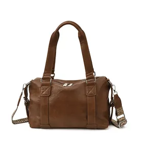 Vintage brown leather tote bag with stylish colorful ethnic pattern woven shoulder strap