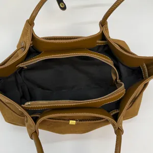 Vintage brown suede tote bag with large capacity interior compartments and gold metal clasp