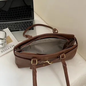 Retro brown high-capacity shoulder bag with textured leather and multiple compartments