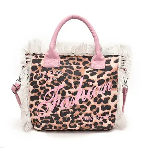 Leopard print canvas tote bag with pink handles, white fringes and fashion lettering