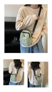 Detail of mint green waterproof oxford mini crossbody bag with adjustable strap