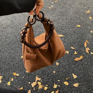 Brown vintage hobo bag with unique dark brown wooden beaded handle for autumn style
