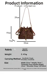 Detail view of leopard print bucket bag with drawstring closure and beaded charm accessory