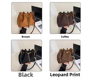 Detail view of drawstring bucket bags in brown, coffee, black, and leopard print options