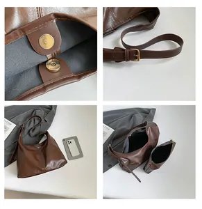 Detail view of brown leather tote bag with magnetic clasp and adjustable strap