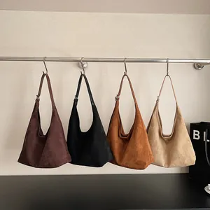 Retro matte large-capacity tote bags in four colors hanging on a minimalist display