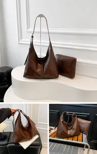 Deep brown oversized hobo shoulder bag set with matching small pouch in high-gloss leather