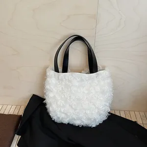 Chic white fuzzy bucket handbag with black leather handles for 2025 autumn fashion