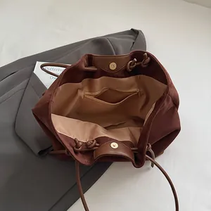 Minimalist brown matte tote bag with rope straps and spacious inner storage compartment