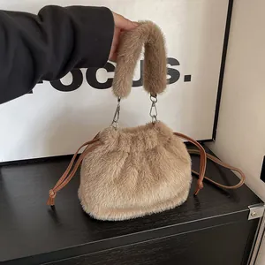 Stylish light brown plush drawstring bucket bag with soft faux fur and crossbody strap