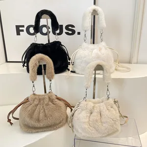 Faux fur drawstring bucket bags in four colors with plush handles and crossbody straps