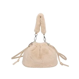 Chic cream white faux fur bucket bag with drawstring closure and plush wide shoulder strap