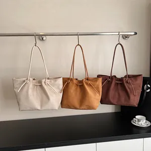 Minimalist faux suede tote bag in three colors with knotted tassel detail for women