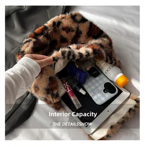 Internal capacity of leopard print plush bag showing storage for makeup and gadgets