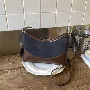 Retro large suede shoulder bucket bag with navy and brown leather patchwork design