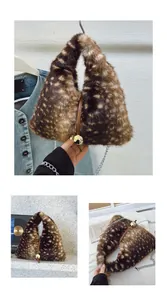 Detail of deer print faux fur handbag with golden ball clasp and delicate chain strap