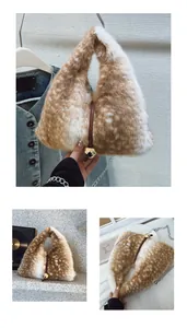 Close-up of plush triangle handbag with deer print texture and golden ball charm
