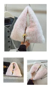 Detail of plush faux fur texture with gold metal sphere and chain on gradient shoulder bag