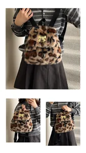 Detail of leopard print faux fur backpack with golden bow hardware and black straps