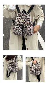 Detail of leopard faux fur backpack showing metal bow buckle and drawstring closure