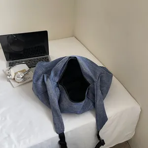 Minimalist large capacity blue denim tote bag for women showing spacious interior storage