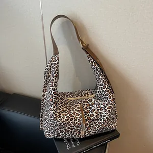 Chic leopard print large tote bag with brown leather strap and metal zipper detail