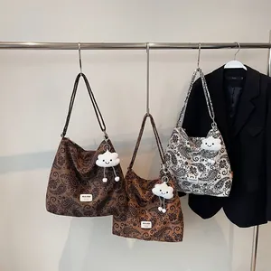 Fashionable paisley print canvas tote bags in brown and beige with cloud charm