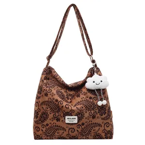 Vintage paisley print large shoulder bag with cute cloud charm and durable canvas strap