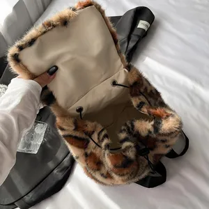 Chic leopard print faux fur drawstring backpack for women featuring a plush texture