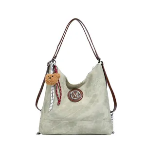 Sac hobo polyvalent en denim vert clair avec brides en cuir et breloque logo M