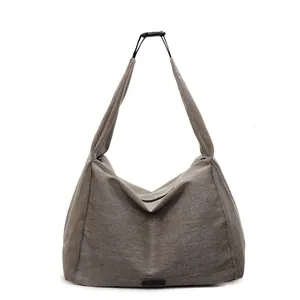 Large minimalist canvas tote bag in deep khaki color with wide shoulder strap design