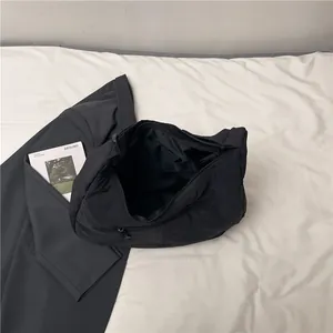 Minimalist black quilted puffer tote bag with large capacity and inner pocket view