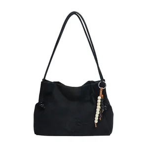 Black leopard suede shoulder bag with VIAOSHE embossing and vintage beaded tassel