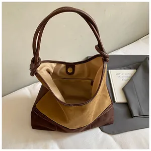 Matte suede hobo tote bag in brown contrast colors with knot strap detail
