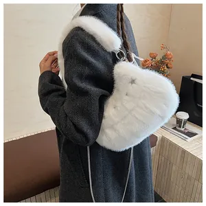 Detail of white faux fur heart bag with star charm, plush strap and metal chain