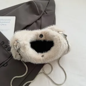 Chic cream faux fur shoulder bag with silver chain strap for autumn winter fashion look