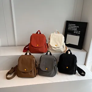 Canvas flap backpacks for men and women in five colors with a yellow buckle detail