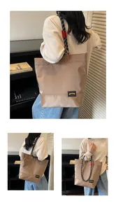 Detail of khaki tote bag featuring rope handles and logo patch in a modern interior