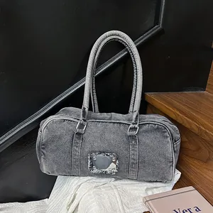Retro grey washed denim Boston bag with metallic plate and frayed edge detail