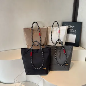 Chic lightweight tote bags in four colors with durable woven rope handles for women