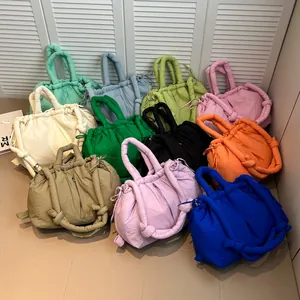 Quilted nylon puffer tote bag collection in multiple vibrant colors with knotted handles