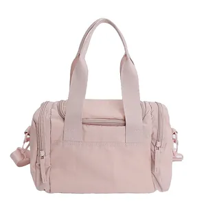 Pink waterproof nylon large capacity travel bag for women with top handles and shoulder strap
