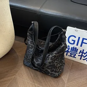 Fashionable leopard print bucket bag with large capacity and black leather strap