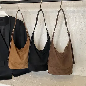 Retro suede hobo bucket bags in brown, black, and tan colors with adjustable straps