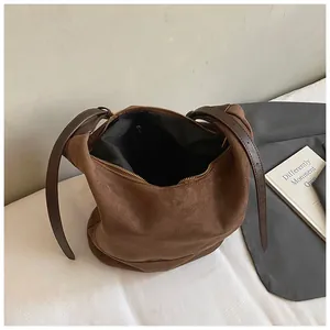 Retro brown suede bucket bag with large capacity and adjustable leather shoulder strap