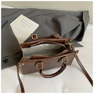 Retro dark brown square shoulder bag for women with gold hardware and spacious interior