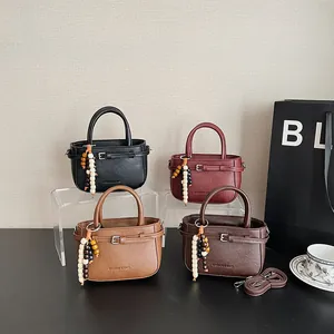 Minimalist faux leather crossbody bags in four colors with decorative wooden beads